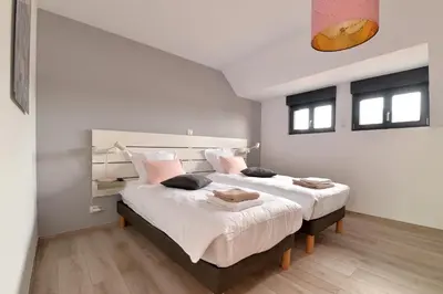 Un ou plusieurs lits dans un hébergement de l'établissement Gîte de Munt'Z SPA, Sauna, piscine, proche de Colmar
