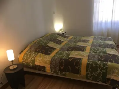 Un ou plusieurs lits dans un hébergement de l'établissement CHEZ LOU ET MAX : UN HAVRE DE PAIX.