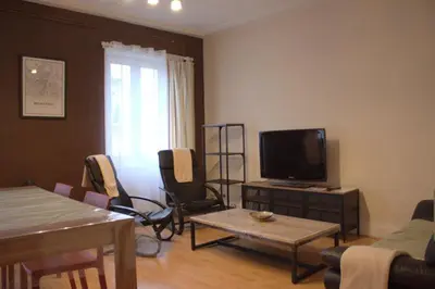 Télévision ou salle de divertissement dans l'établissement Le MONTREAL F3 (2 chambres) Centre Ville/ GareTGV