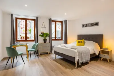 Un ou plusieurs lits dans un hébergement de l'établissement Travel Homes - L'Arsenal, studios en hyper centre