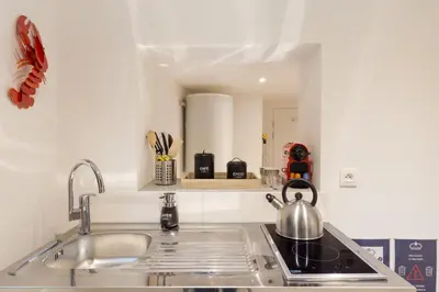 Cuisine ou kitchenette dans l'établissement Travel Homes - L'Arsenal, studios en hyper centre