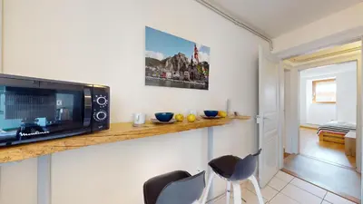 Télévision ou salle de divertissement dans l'établissement Les Cordonniers