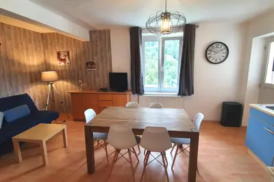 Coin salon dans l'établissement Appart La Bresse - Idéal Famille - Entre Village et Station