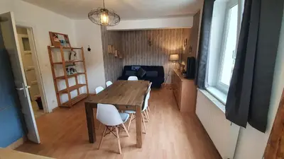 Coin salon dans l'établissement Appart La Bresse - Idéal Famille - Entre Village et Station