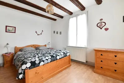 Un ou plusieurs lits dans un hébergement de l'établissement Gîte Le Merle 90m2 près de la route des vins