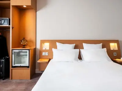 Un ou plusieurs lits dans un hébergement de l'établissement Novotel Belfort Centre Atria