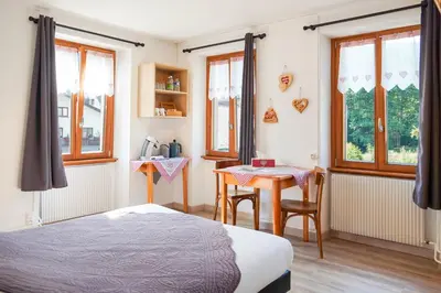 Un ou plusieurs lits dans un hébergement de l'établissement Chambres d'hôtes A la Fecht Nature et Bien-être
