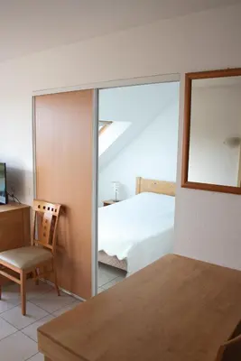 Un ou plusieurs lits dans un hébergement de l'établissement Residence Le Royal Golf & Horse