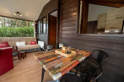 Coin salon dans l'établissement Au Chalet d'Aline - Atypique pour 4 personnes