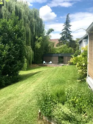Jardin de l'établissement Un petit nid dans la verdure