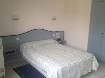 Un ou plusieurs lits dans un hébergement de l'établissement Hotel Le Strasbourg