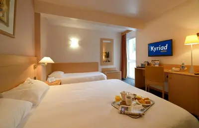 Un ou plusieurs lits dans un hébergement de l'établissement Kyriad Montbeliard Sochaux