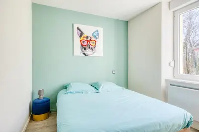 Un ou plusieurs lits dans un hébergement de l'établissement Le 101-GregIMMO-Appart'Hôtel