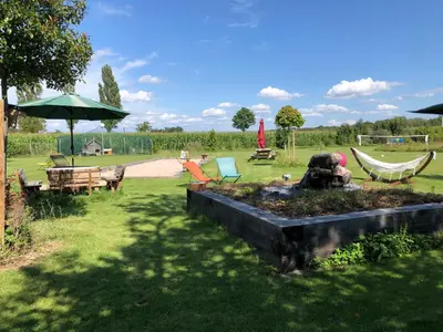 Jardin de l'établissement Les Loges Du Ried - Studios & Appartements proche Europapark