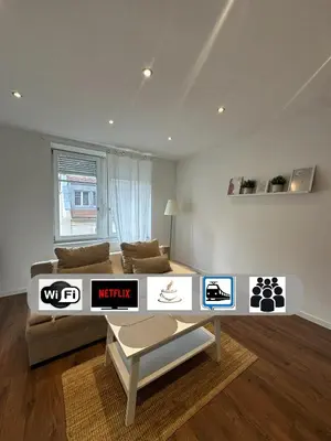 Coin salon dans l'établissement Le 3 - Joli appartement T3 Mulhouse centre, Neuf, calme et tout équipé - stationnement gratuit