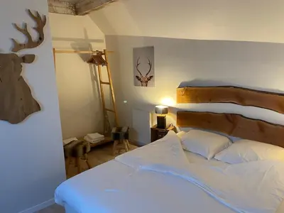Un ou plusieurs lits dans un hébergement de l'établissement Hôtel Restaurant Domaine De Basil