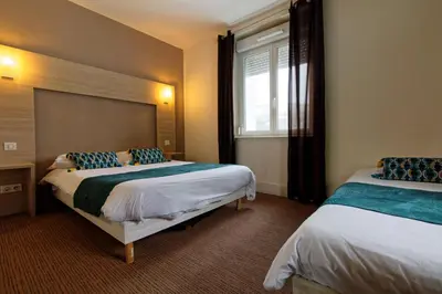 Un ou plusieurs lits dans un hébergement de l'établissement Hotel Restaurant L Echo du Lac
