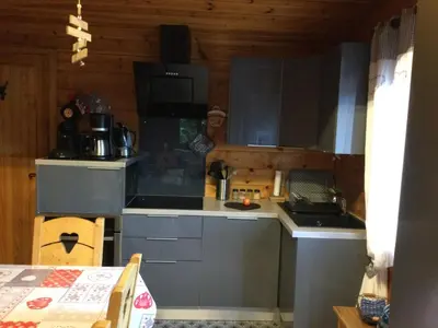 Cuisine ou kitchenette dans l'établissement Chalet le val’tin