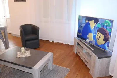 Télévision ou salle de divertissement dans l'établissement Villa le Tramway