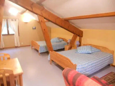 Un ou plusieurs lits dans un hébergement de l'établissement Auberge du Saut des Cuves