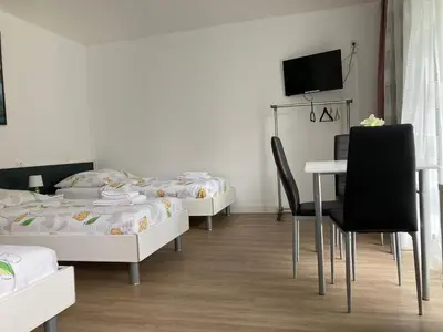 Un ou plusieurs lits dans un hébergement de l'établissement Studios Lora RM 860
