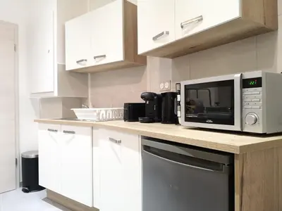Cuisine ou kitchenette dans l'établissement LE WILSON SUITE - Centre-ville - Gare - Tram