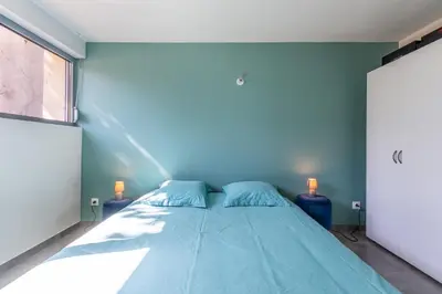 Un ou plusieurs lits dans un hébergement de l'établissement Le 21 -GregIMMO-Appart'Hôtel