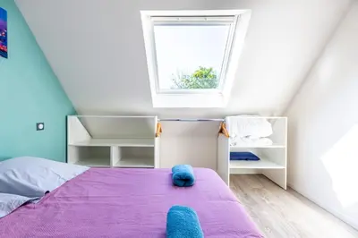 Un ou plusieurs lits dans un hébergement de l'établissement Le 201-GregIMMO-Appart'Hôtel