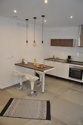 Cuisine ou kitchenette dans l'établissement La Villa Vauban