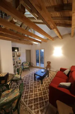 Coin salon dans l'établissement Chalet les airelles -chalet cosy près de colmar dans les vosges