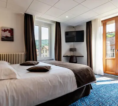Un ou plusieurs lits dans un hébergement de l'établissement Hotel Le Bellevue