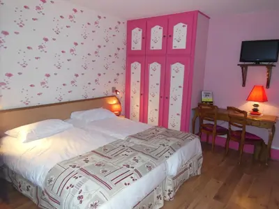 Un ou plusieurs lits dans un hébergement de l'établissement Hotel Le Bellevue