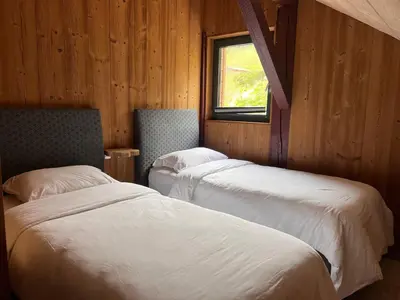 Un ou plusieurs lits dans un hébergement de l'établissement Grand Cerf - Vue Panoramique La Bresse-Gerardmer