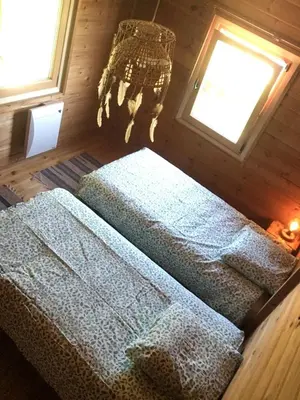 Un ou plusieurs lits dans un hébergement de l'établissement Chalet Le Cactus avec sauna privatif