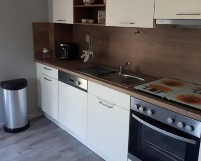 Cuisine ou kitchenette dans l'établissement Le chouette gîte