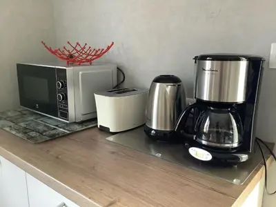 Cuisine ou kitchenette dans l'établissement Le chouette gîte