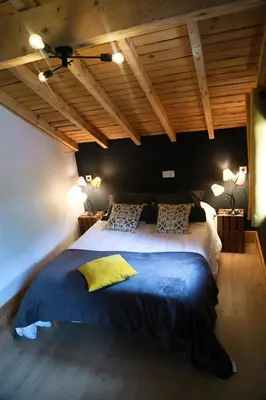 Un ou plusieurs lits dans un hébergement de l'établissement Le petit coin de Jeanne et Marcel chalet de vacances La Bresse