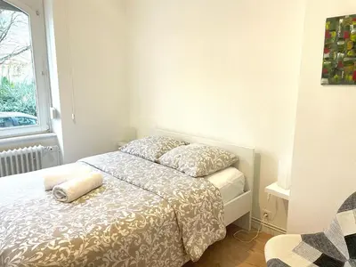 Un ou plusieurs lits dans un hébergement de l'établissement Gite du Grillen Colmar