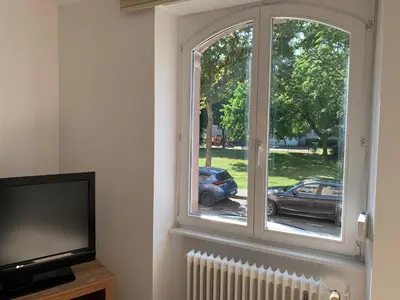 Télévision ou salle de divertissement dans l'établissement Gite du Grillen Colmar