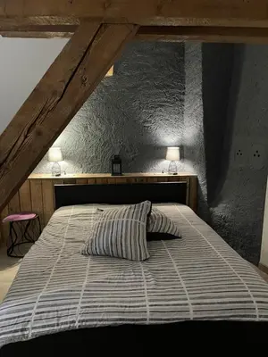 Un ou plusieurs lits dans un hébergement de l'établissement Gîte Les lavandières