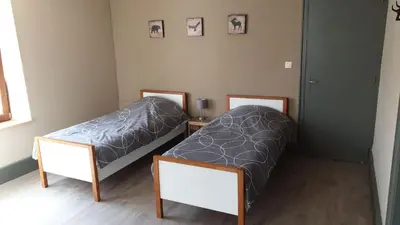 Un ou plusieurs lits dans un hébergement de l'établissement Au Pied du Gazon