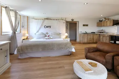 Un ou plusieurs lits dans un hébergement de l'établissement AU NID COSY D'ISA A GERARDMER VOSGES - Spas privatifs