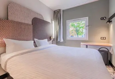 Un ou plusieurs lits dans un hébergement de l'établissement B&B HOTEL Mulhouse Dornach
