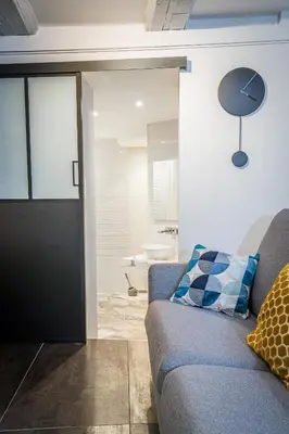 Coin salon dans l'établissement Appart 4 pers design et cosy avec Jardin au Cœur de Sélestat