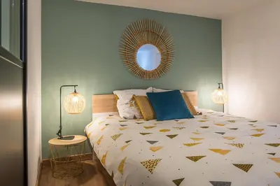 Un ou plusieurs lits dans un hébergement de l'établissement Appart 4 pers design et cosy avec Jardin au Cœur de Sélestat