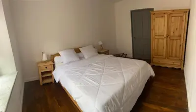 Un ou plusieurs lits dans un hébergement de l'établissement Le Chellois appartement La Bresse