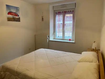 Un ou plusieurs lits dans un hébergement de l'établissement Le Chellois appartement La Bresse