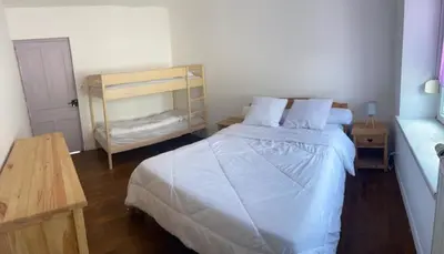 Un ou plusieurs lits dans un hébergement de l'établissement Le Chellois appartement La Bresse
