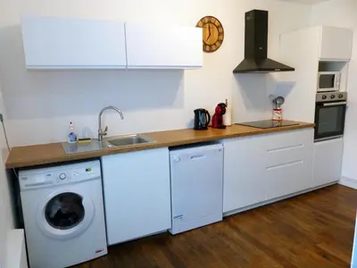 Cuisine ou kitchenette dans l'établissement Le Chellois appartement La Bresse