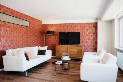 Télévision ou salle de divertissement dans l'établissement LE 19 KLEBER climatisé